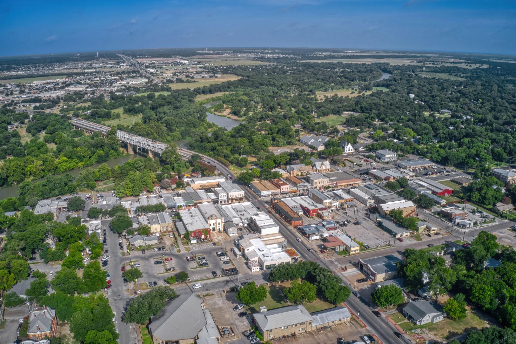 Aerial view of downtown Bastrop, the Colorado River, and the Lost Pines